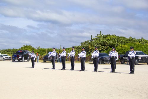 Miami Beach Police Honor Guard performing ceremony on sand