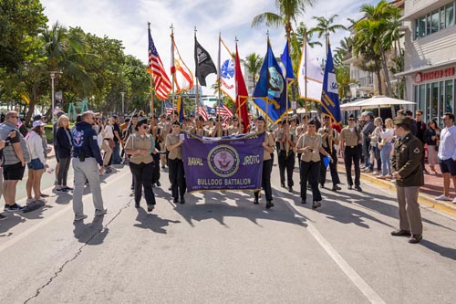 JROTC holding "BULLDOG BATTALION" flag