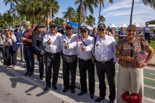 people standing giving thumbs up