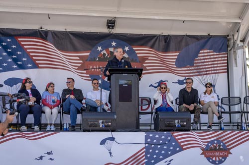 mayor at podium with people seated behind him