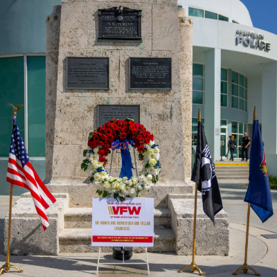 Flags and wreath outside of Miami Beach Police Headquarters