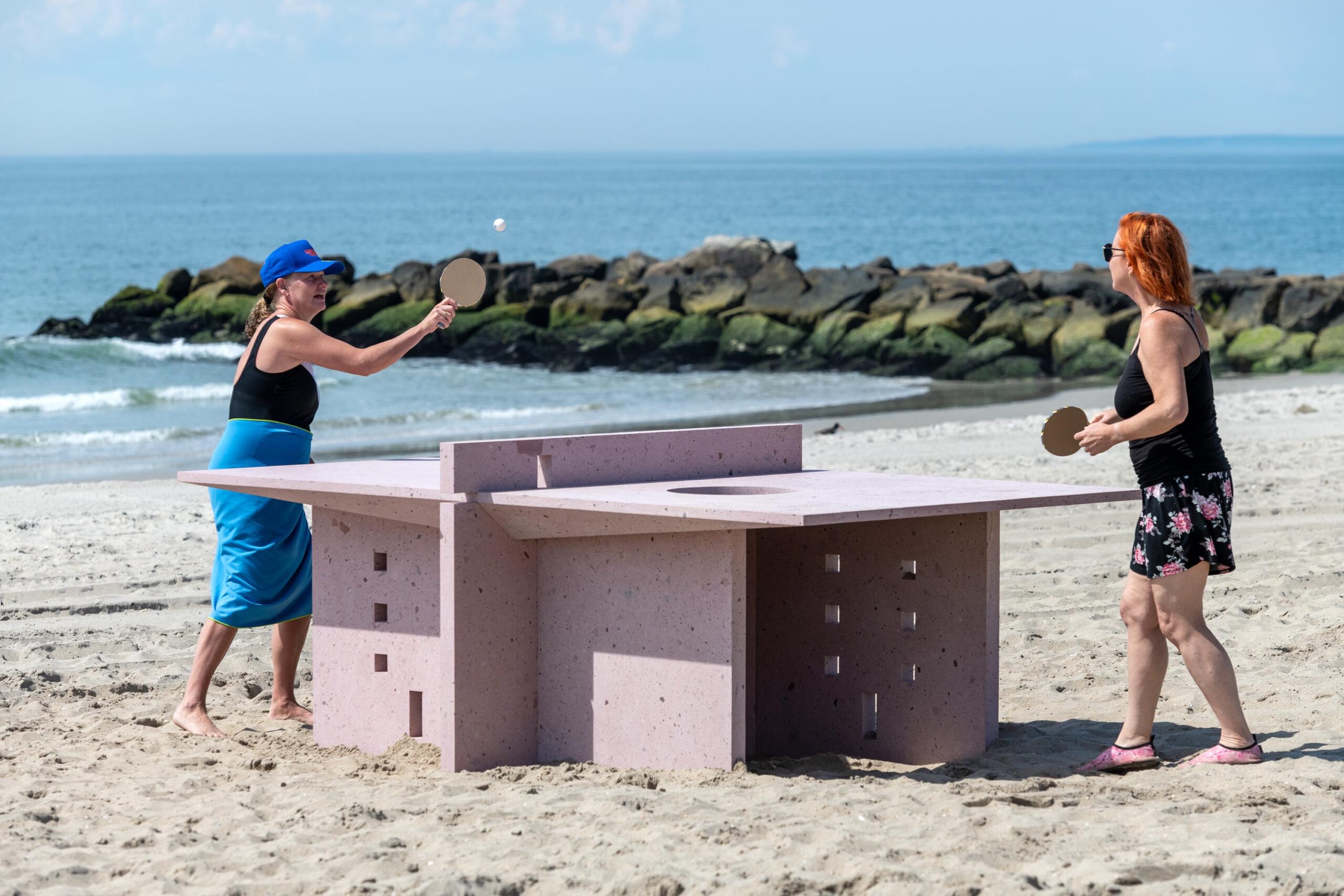 TWO WOMEN PLAYING PING PONG